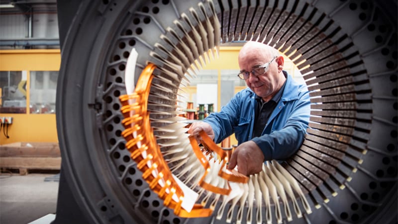 Older man working in factory